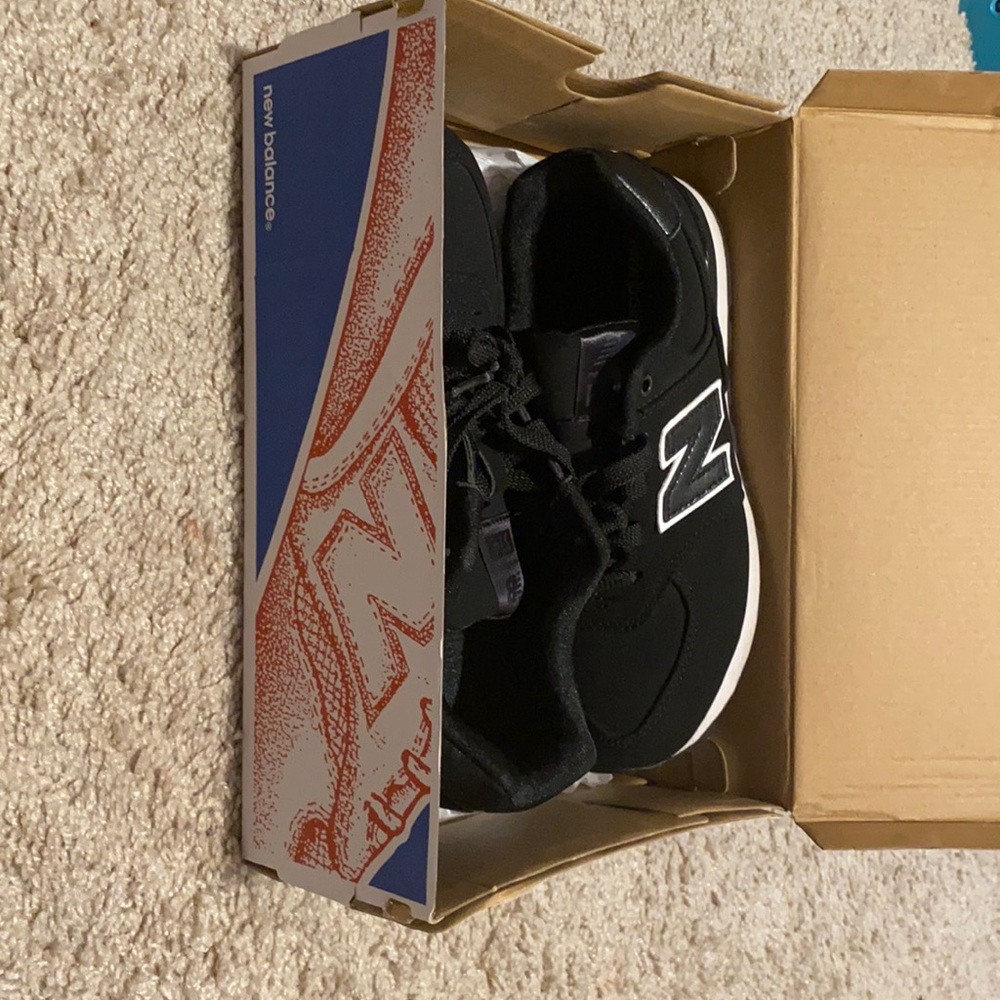 New Balance Shoes in a size 3 , black .